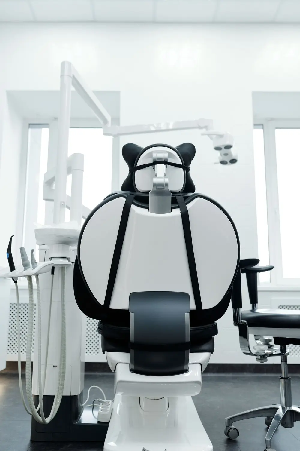 Dental chair in a bright treatment room
